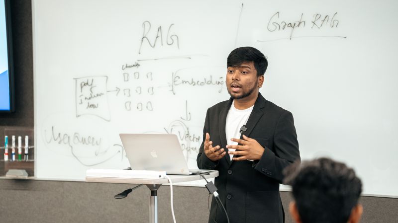 Suvojit presenting RAG and Graph RAG concepts at DevPalooza 4.0